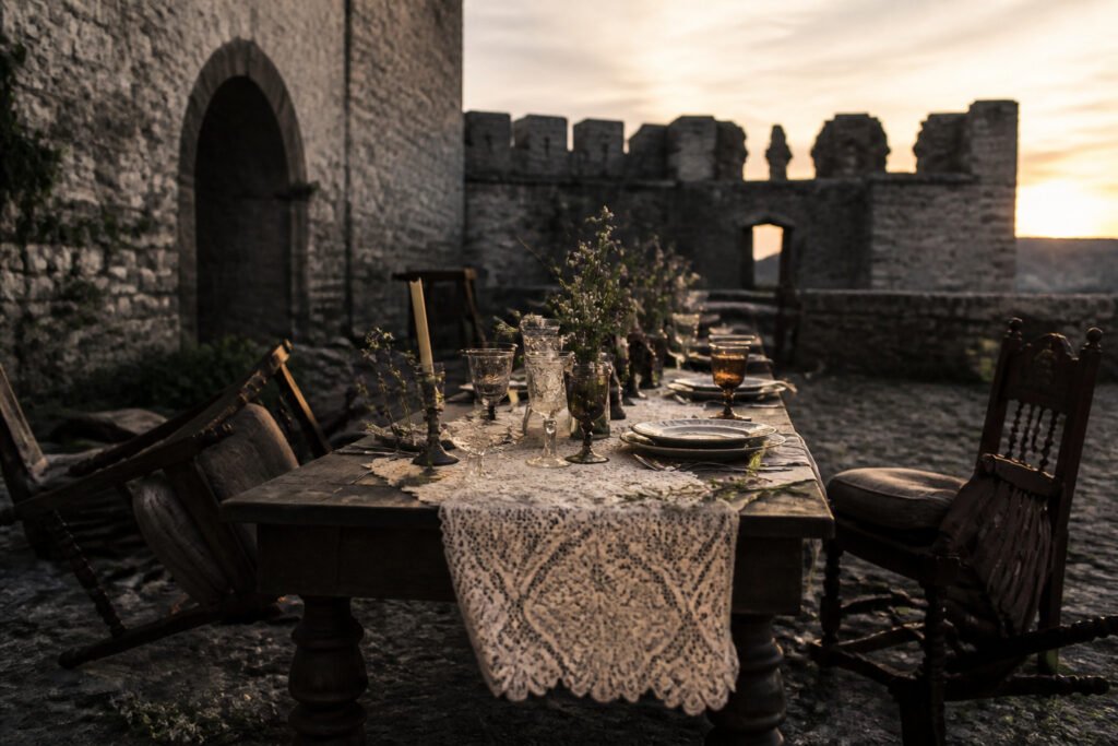 A wedding ceremony set in a fantasy landscape with medieval attire.